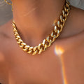 Gold women's thick chain necklace with 6cm pendant on a 32cm chain, shown from the front.