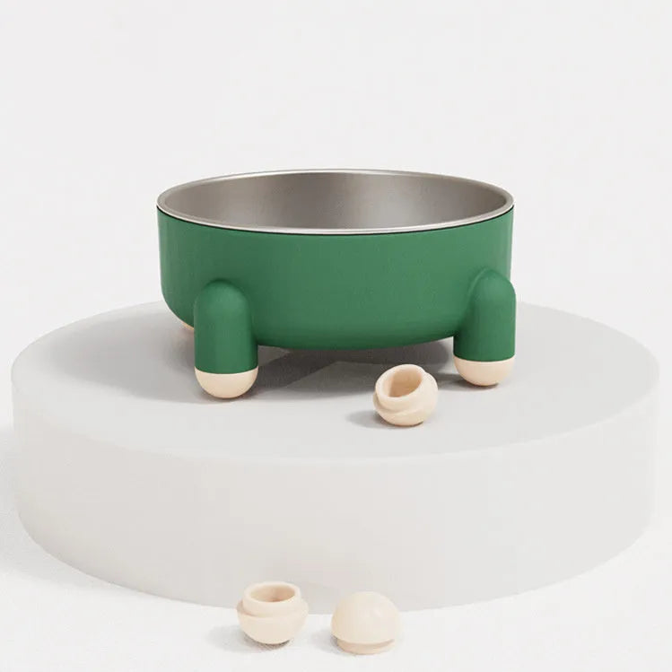 Green non-slip stainless steel pet bowl with high foot base on a floor.