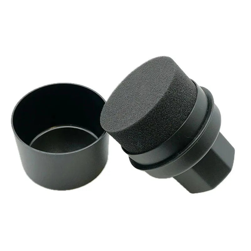 Black car tyre polishing sponge brush with a red lid, showing its size next to a car tyre.