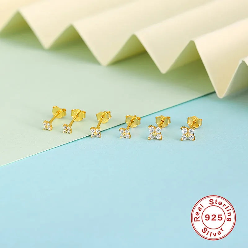 S925 sterling silver stud earrings with geometric petal and flower crystals in gold or platinum finish.