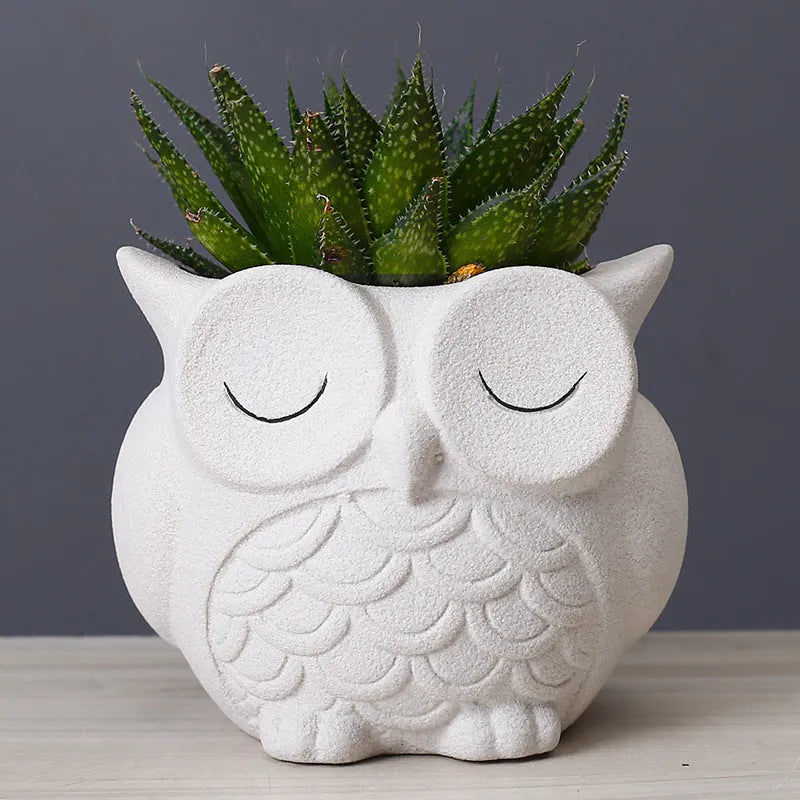 Handmade frosted owl ceramic succulent pot in light pink, showing cartoon design and 11cm size.