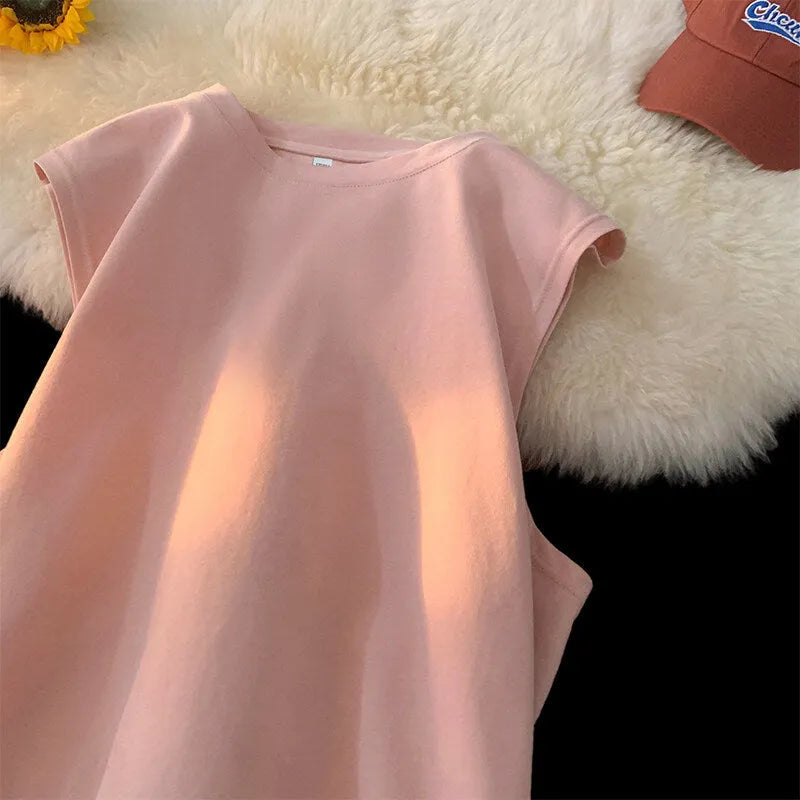 Men's loose solid colour cotton tank top on a hanger, showing straight hem and sleeveless design.