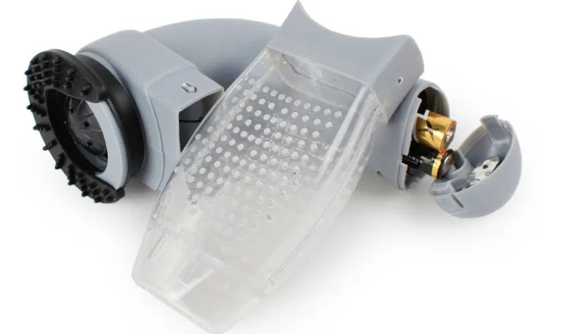 Grey portable electric pet hair removal vacuum with soft rubber grooming head.