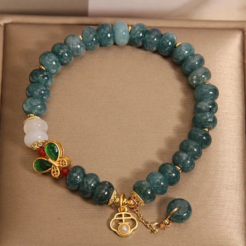 Blue jade abacus beads crystal bracelet with alloy inlay, rhinestone accents, butterfly charms and white agate beads