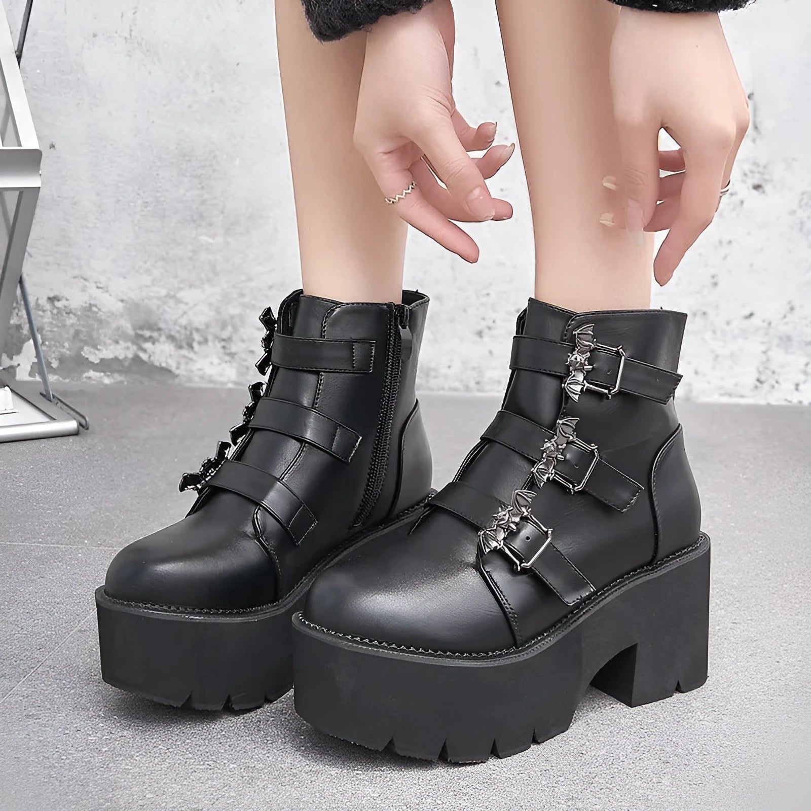 Black women's Harajuku punk Gothic Martin boots with bat buckle, side zip, and thick heel.