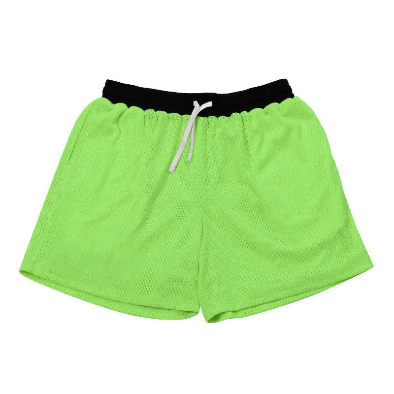 Men's solid colour quick-drying mesh sports shorts in black, shown for running.