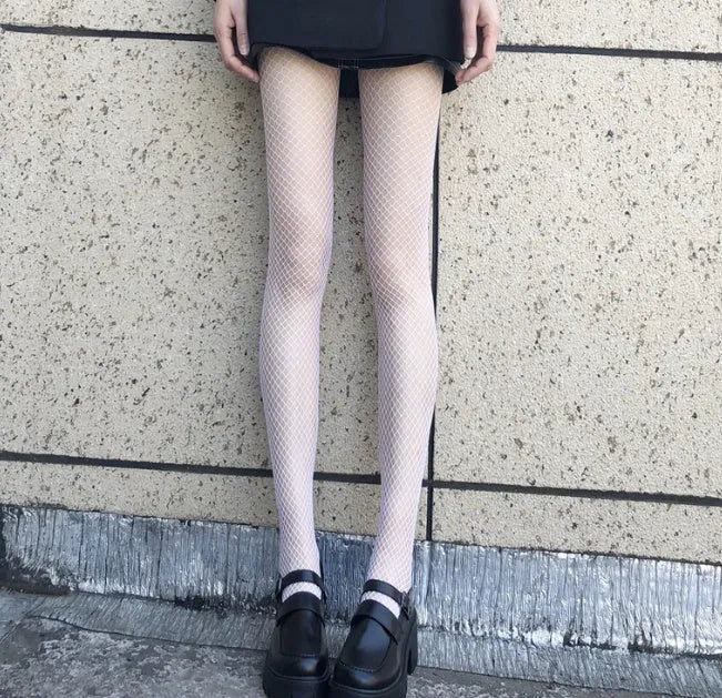 Women's mesh stockings in large, medium and small patterns in black and white colours
