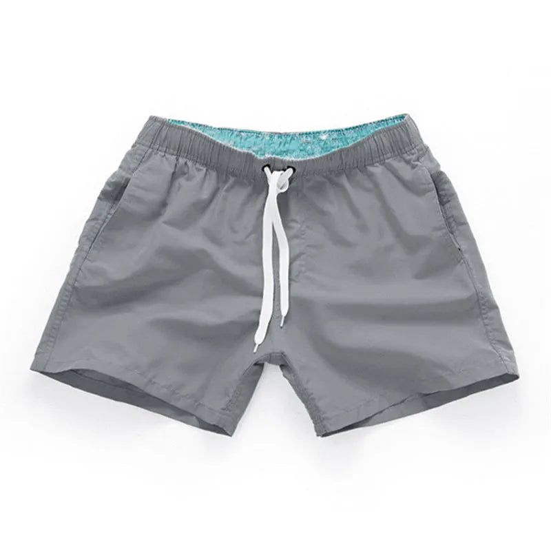 Men's straight leg polyester beach shorts in multiple colours with extended sizing options