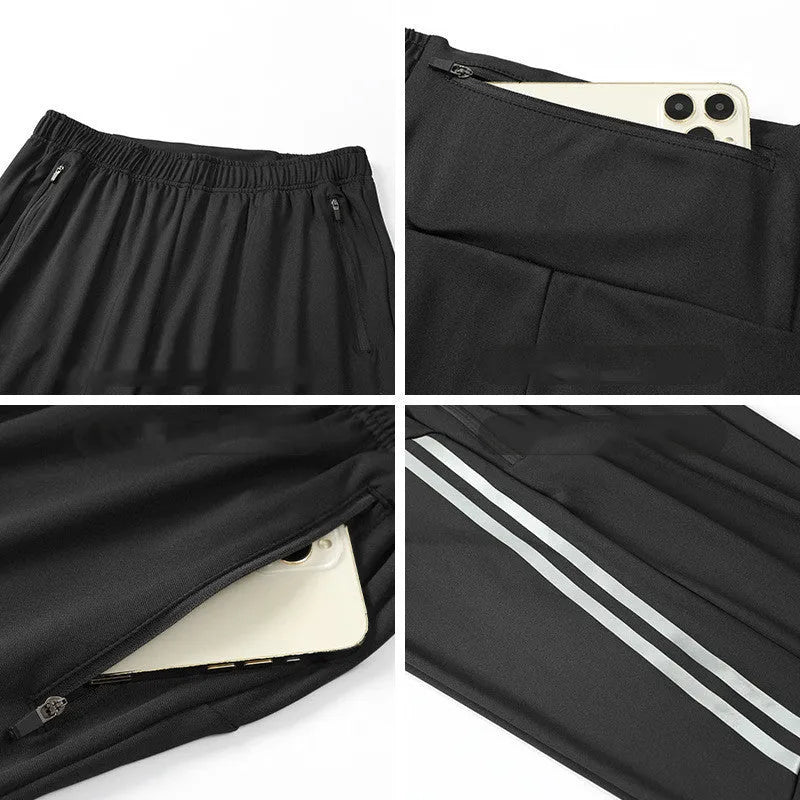 Men's black breathable polyester running trousers with mid-waist fit on a plain background.