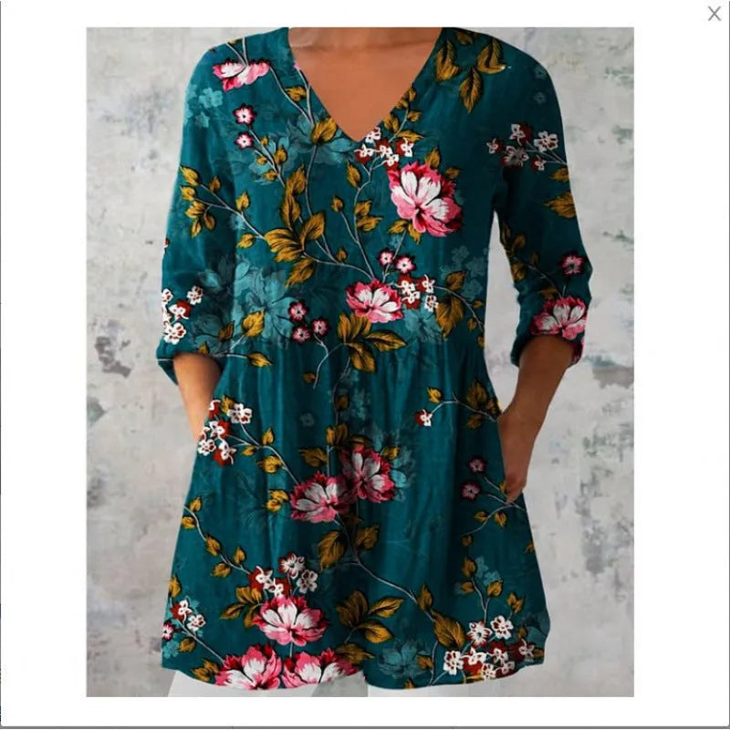 Women's loose fit printed dress with wide waist and three-quarter length sleeves.