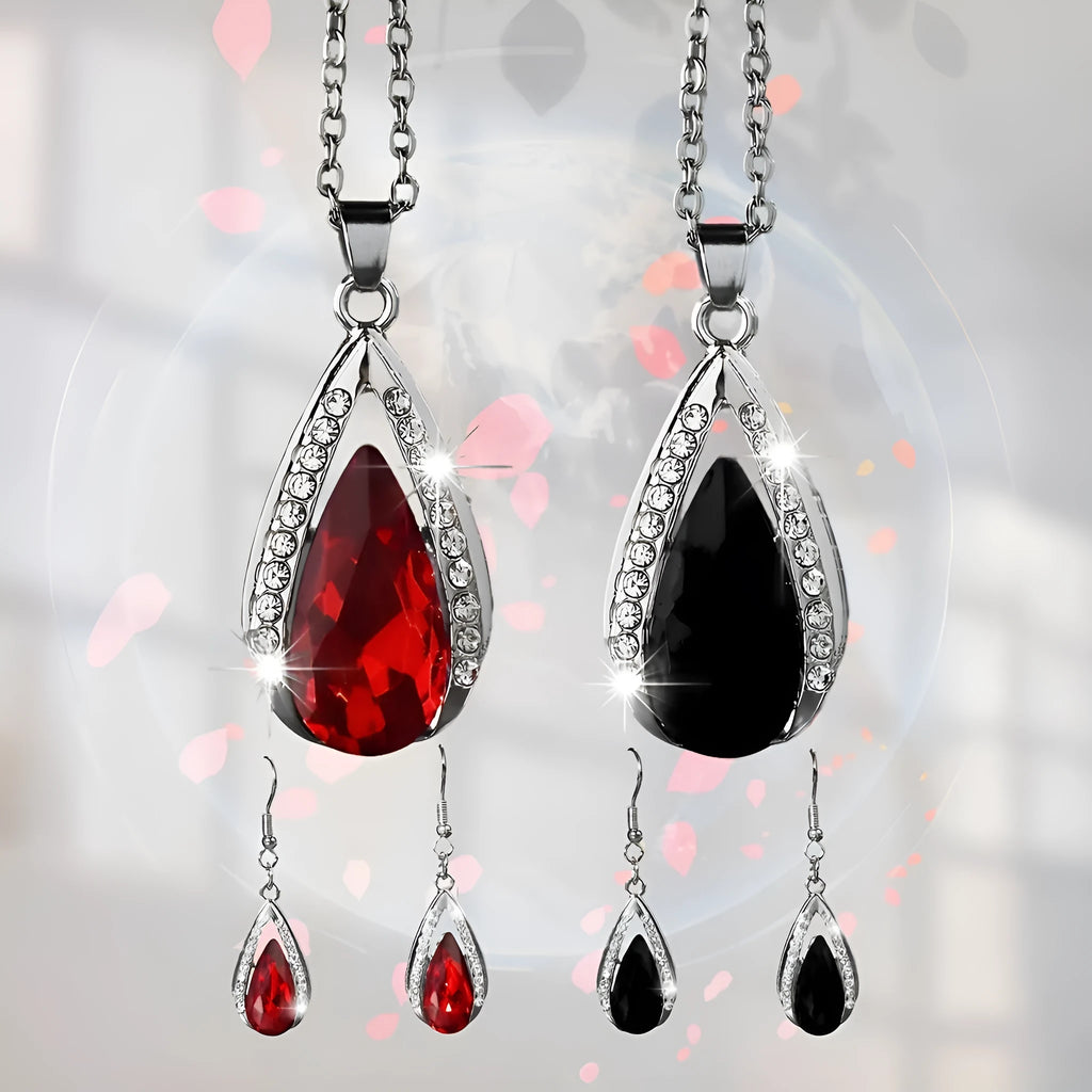 Alloy teardrop glass pendant necklace and matching earrings set in black or red.