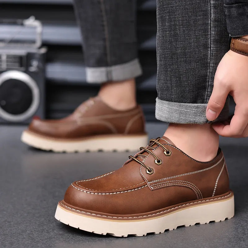 Men's black retro low-top casual worker boots with a rounded toe and rubber sole.