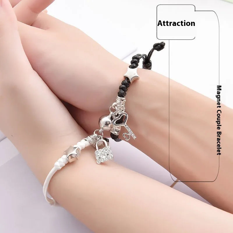 Magnet suction couple bracelets with alloy construction and various pendant designs including crowns and hearts