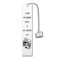 Stainless steel bookmark with tassel and engraved lettering in a gift box.