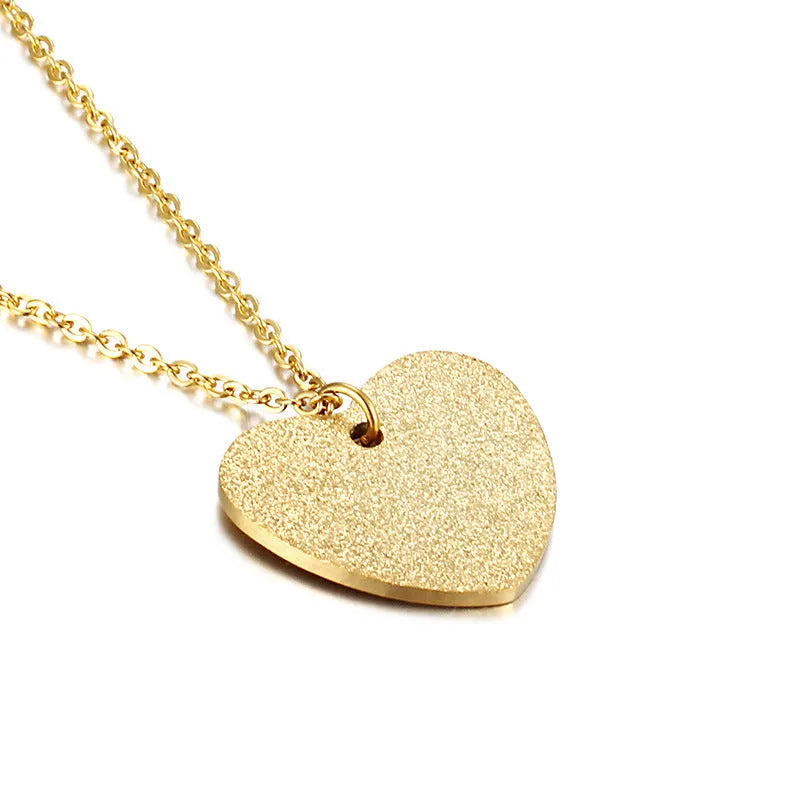 A geometric heart-shaped blue titanium steel pendant necklace on a chain.