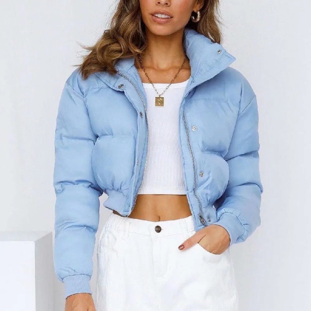 Loose blue polyester jacket for women with long sleeves on hanger