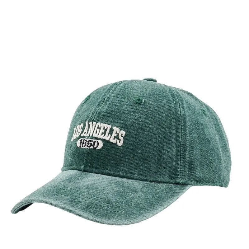 Retro distressed personalised baseball cap with embroidered letters on the front, showing adjustable strap.