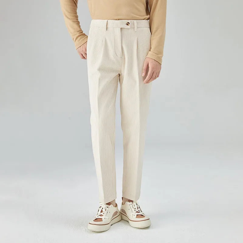 Men's straight-leg corduroy trousers in a loose fit, shown in beige colour.