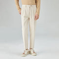 Men's straight-leg corduroy trousers in a loose fit, shown in beige colour.