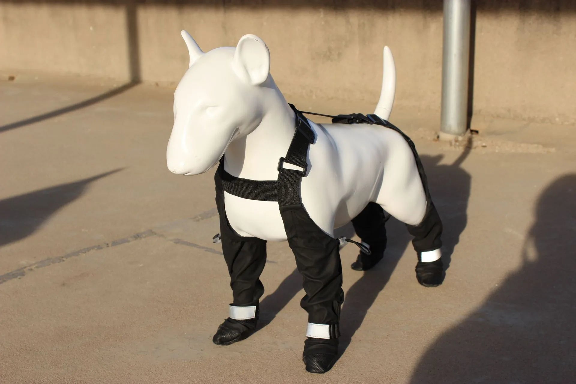Black waterproof dog shoes with a strap closure and non-slip soles, shown in size L.