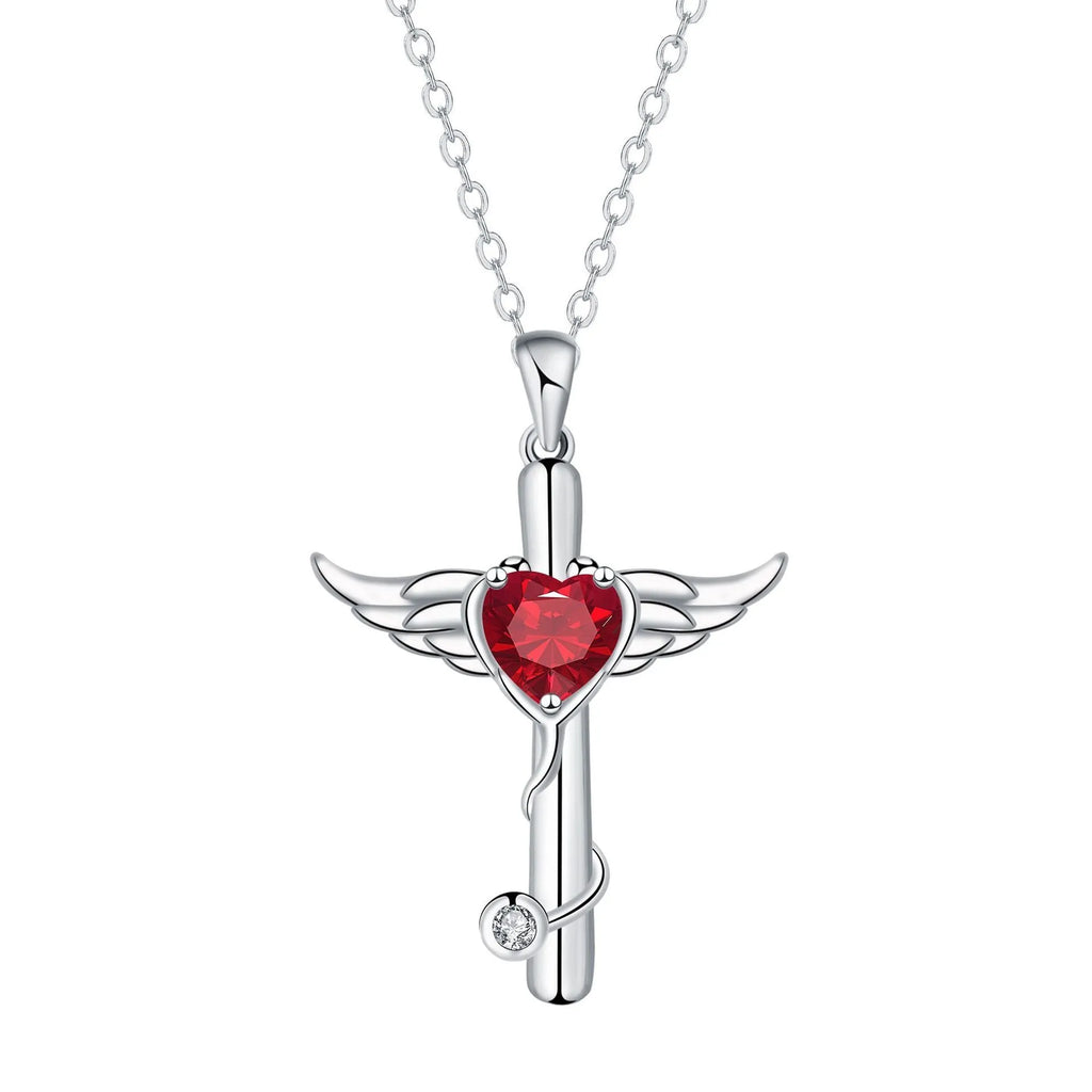 Close-up of a women's necklace with a cross, stethoscope, and wings pendant in electroplated copper.