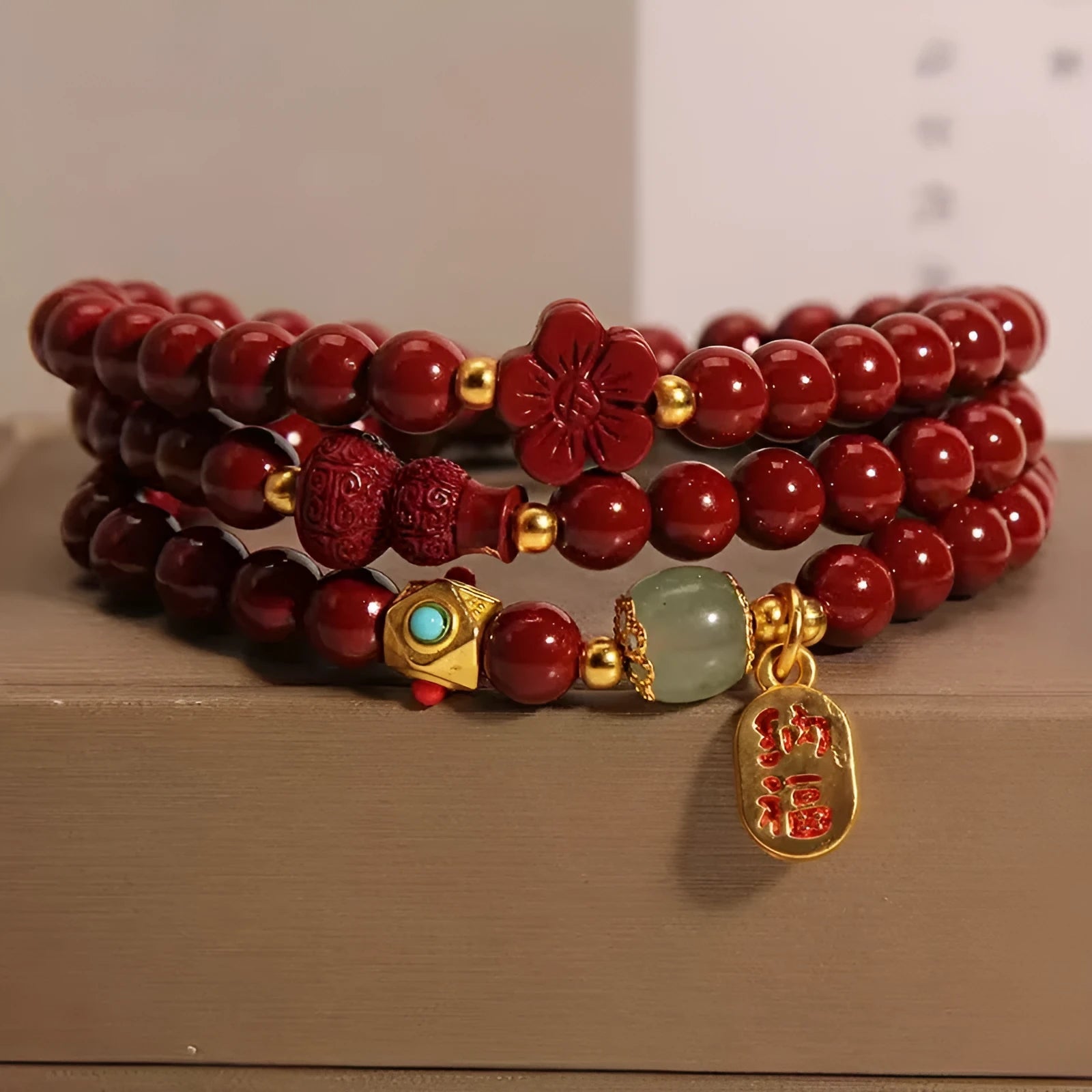 6mm cinnabar bracelet with multi-circle gourd and five petal flower Chinese design in polished finish