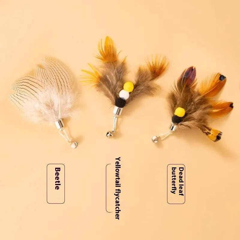Three small steel wire insect-shaped replacement heads for cat wand toys on a white background.