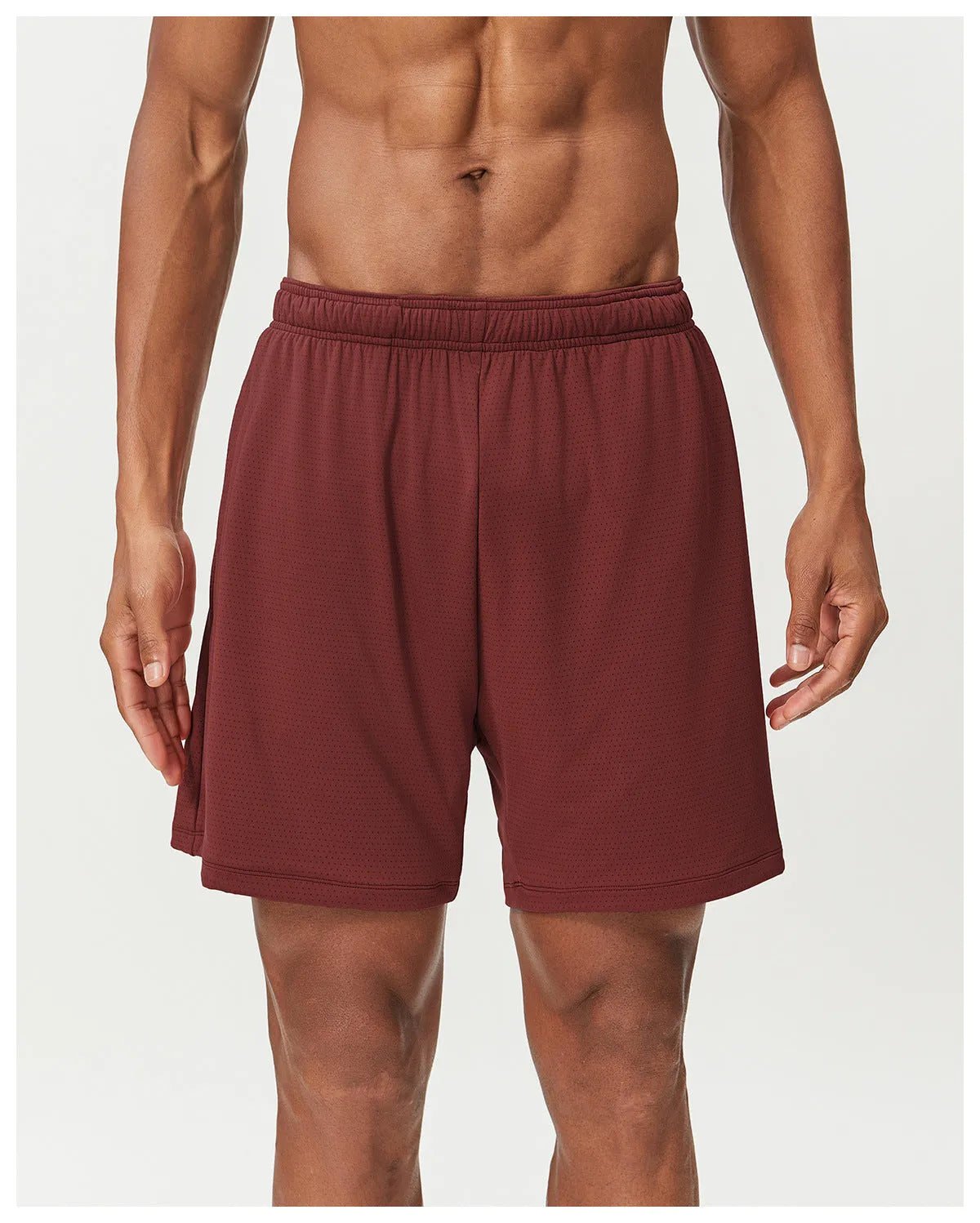 Men's quick-dry double-layer running shorts in a brick red colour on a mid-waist fit model.