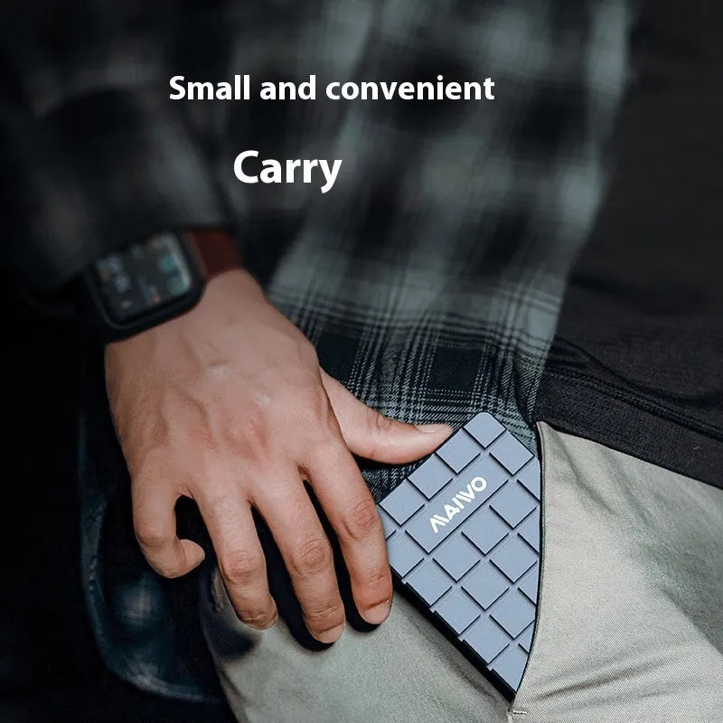 Aluminium USB4 hard disk enclosure for SSD, shown next to a MacBook.