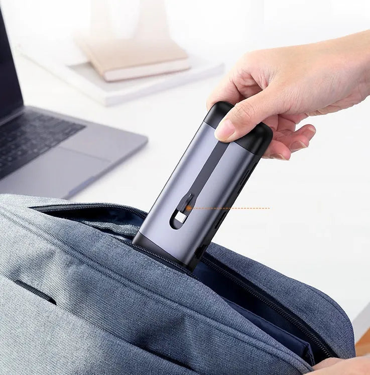 USB-C docking station hub with short cable showing HDMI, USB 3.0, PD charging, VGA, and Ethernet ports.
