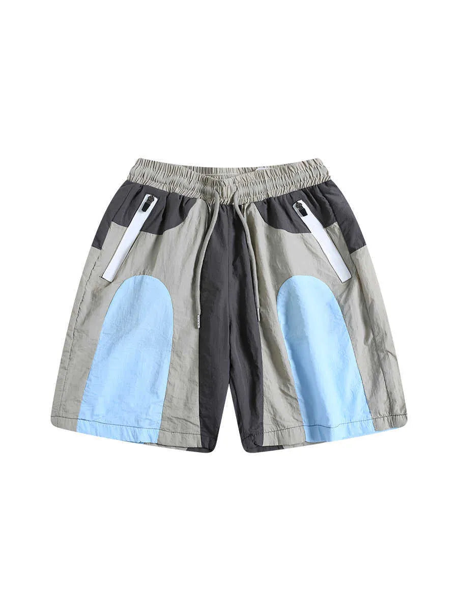 Blue patchwork outdoor sports shorts with loose straight-leg fit and above-the-knee length