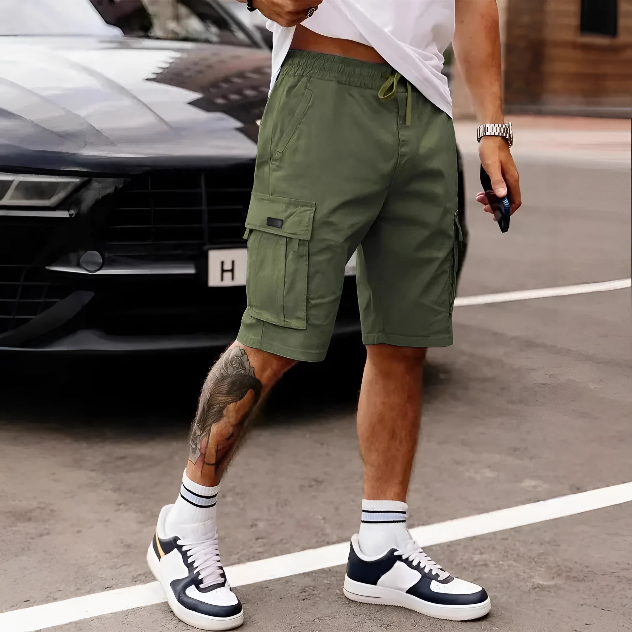 Men's loose fit straight leg cropped workwear shorts in light grey on a mannequin