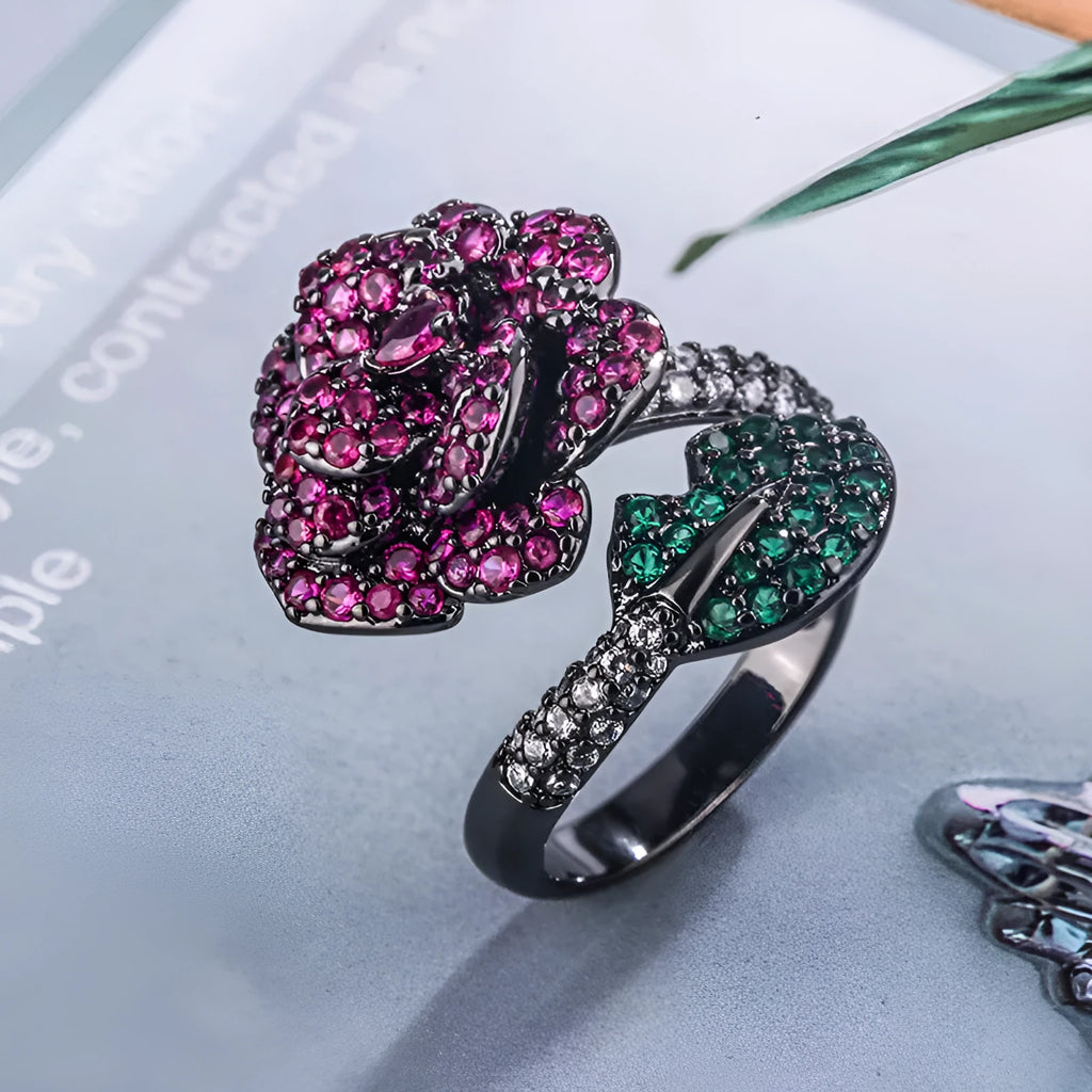 Geometric black gold plated flower ring with red simulated corundum stones for women.