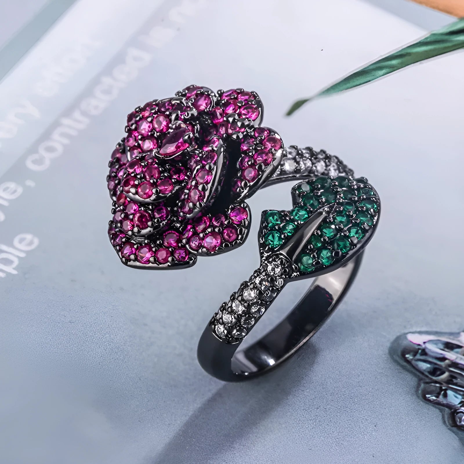 Geometric black gold plated flower ring with red simulated corundum stones for women.