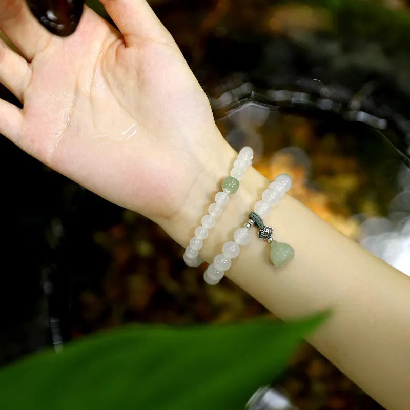 S925 silver and white agate Hetian jade lotus bracelet with geometric national style design