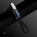 Magnetic three-in-one mobile phone charging cable with black, white, and red colour-coded tips