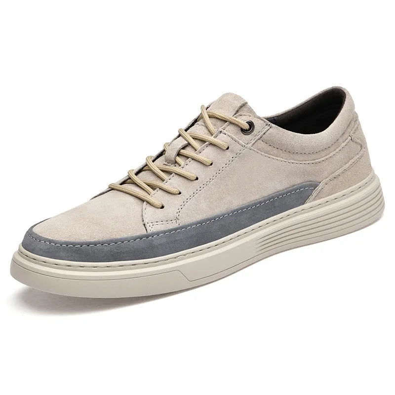 Men's grey casual leather skate shoes with low-top design and round toe on a rubber sole.