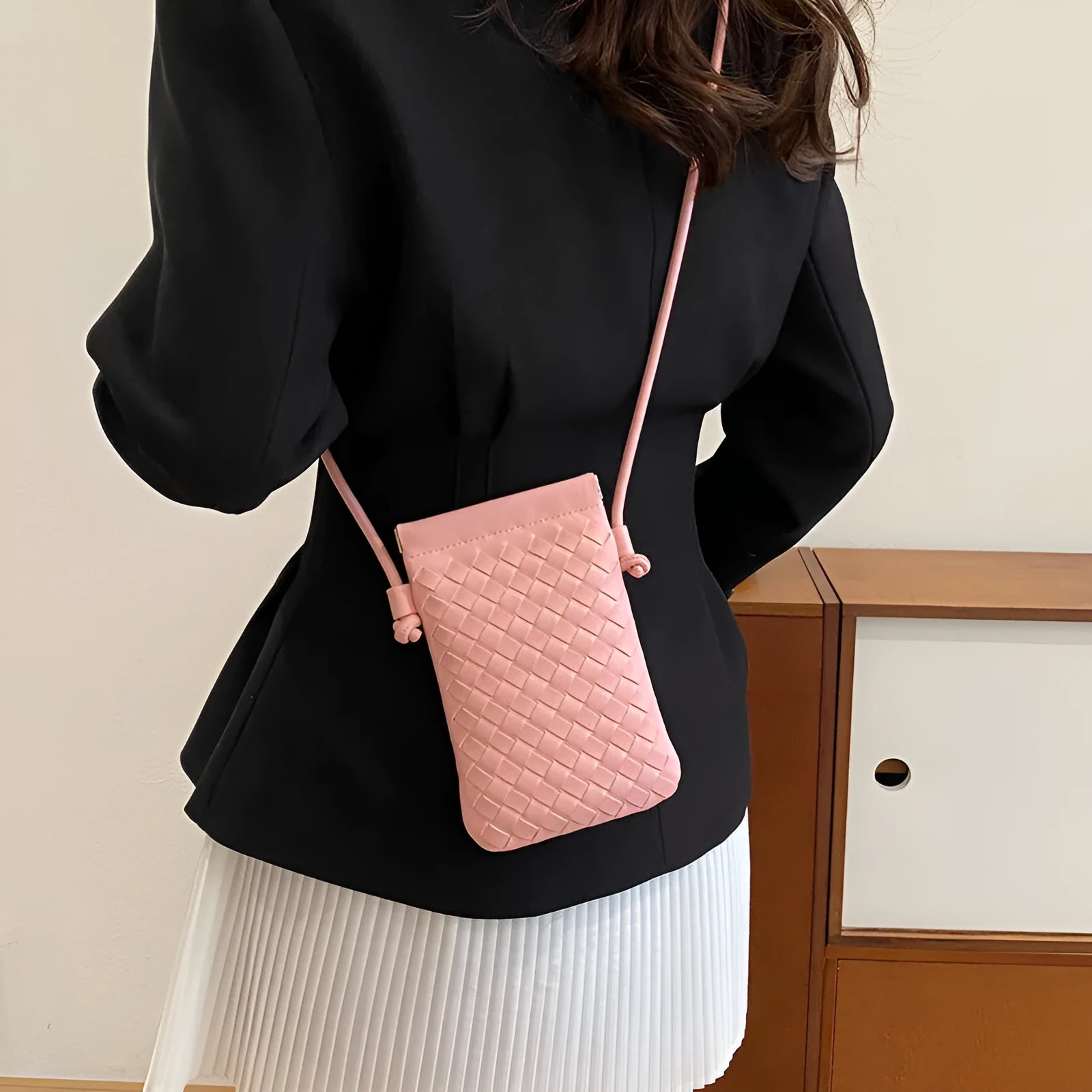 Vintage weave crossbody bag in vertical square shape showing European retro styling and dark cell internal compartment