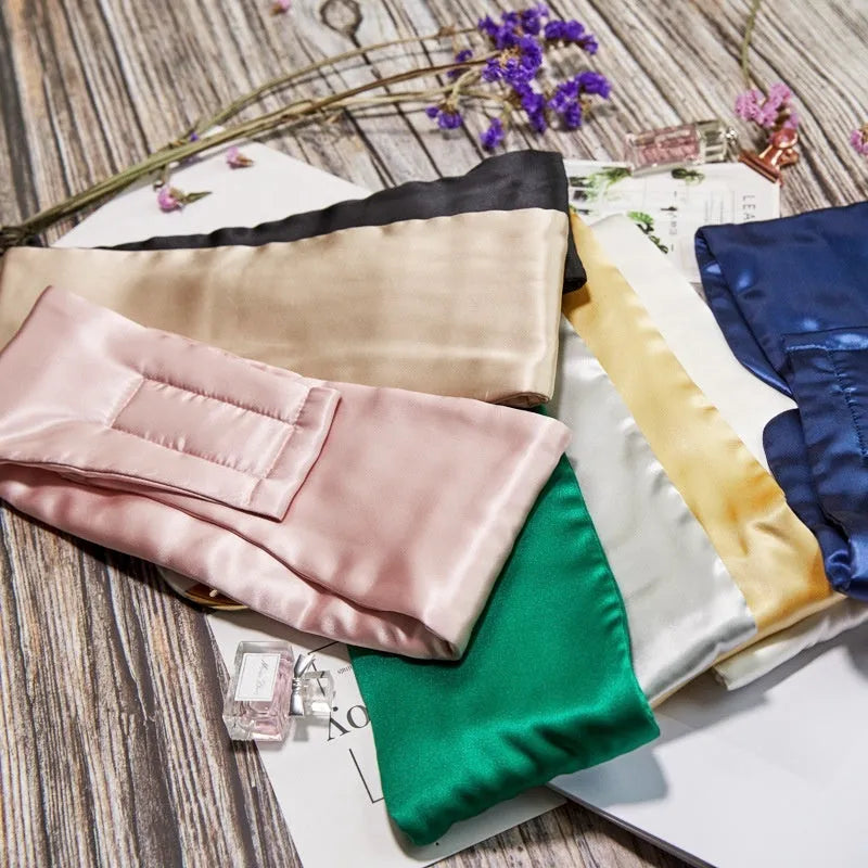 Mulberry silk sleep eye mask shown in one of seven colours: black, gold, blue, gray, white, pink, or green.