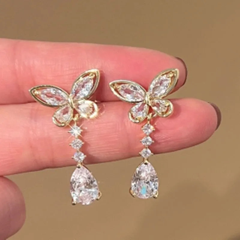 Platinum colour bow stud earrings with electroplated finish on zinc alloy