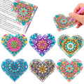 Six handmade PU leather bookmarks with crystal flower cornerite designs on a surface.
