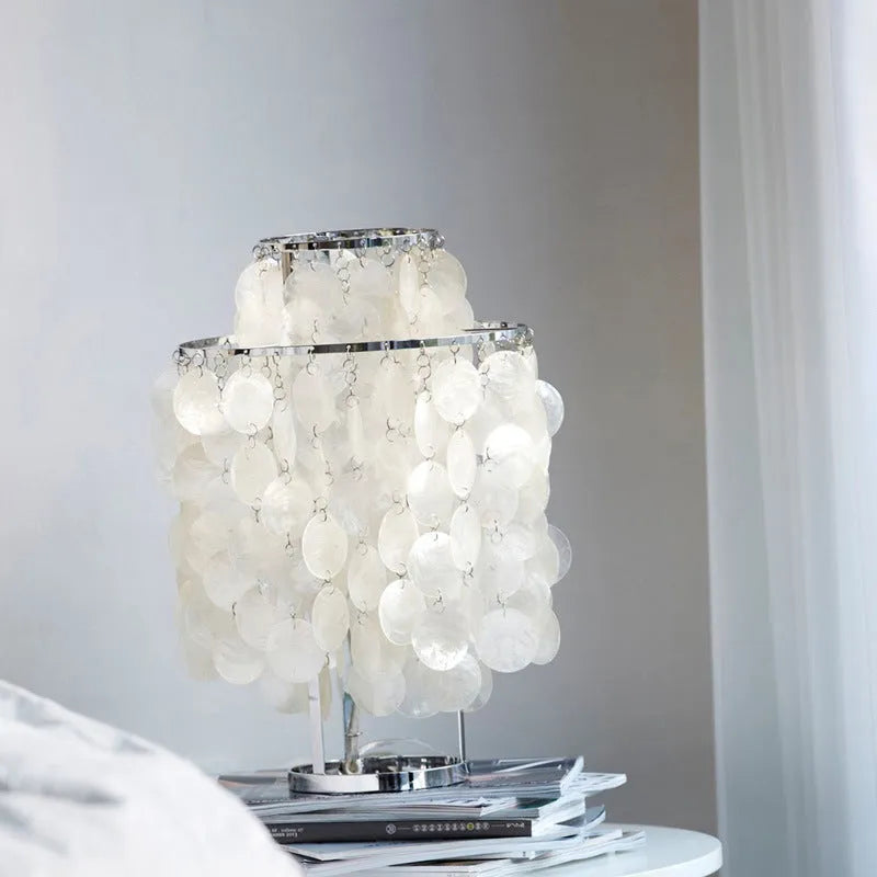 Modern shell-shaped table lamp in chrome or gold finish, 46cm tall.