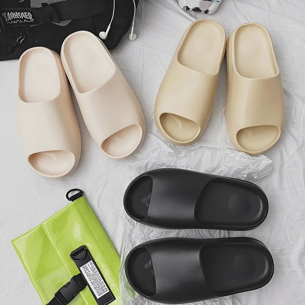 Women's thick-sole beach slippers in black, green, or brown on an EVA sole.