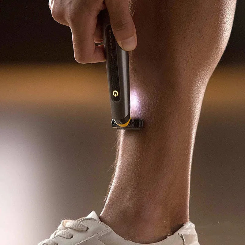 Black wireless rechargeable men's shaver with LED light on a compact stainless steel blade head