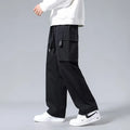 Boys' straight-leg cargo trousers in army green with large pockets and a drawstring waistband.