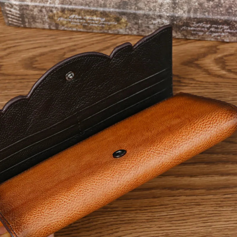 Retro brown women's tri-fold leather wallet with an embossed floral pattern, shown open and closed.