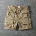 Men's straight-leg cargo shorts in army green with multiple pockets, made from stretch cotton fabric.