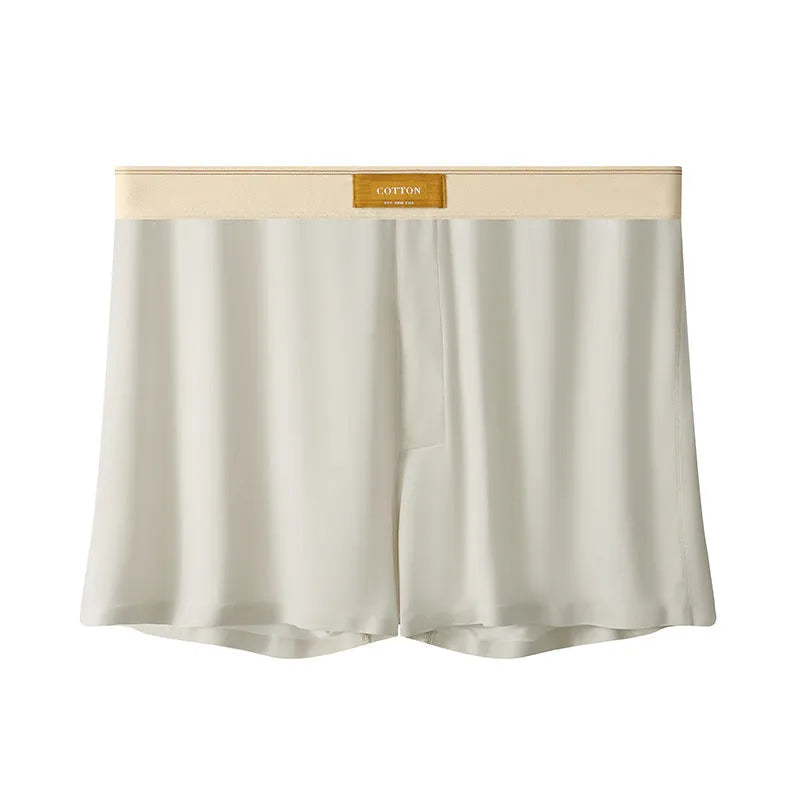 Men's solid colour ice silk underwear with a loose fit and mid waistband on a neutral background.