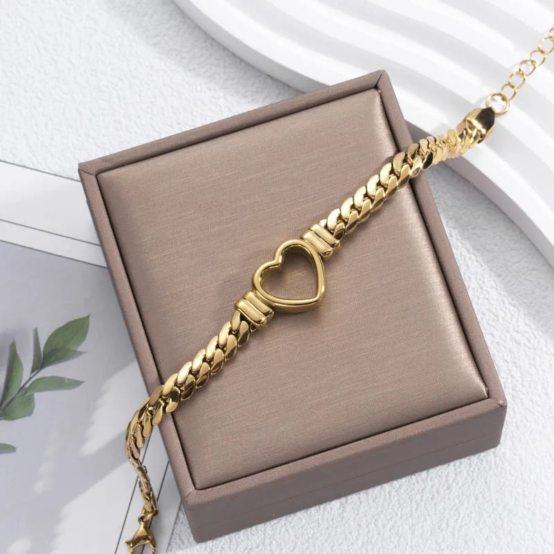 Fashion simple hollow heart titanium steel bracelet in BR-26 gold colour with electroplated finish