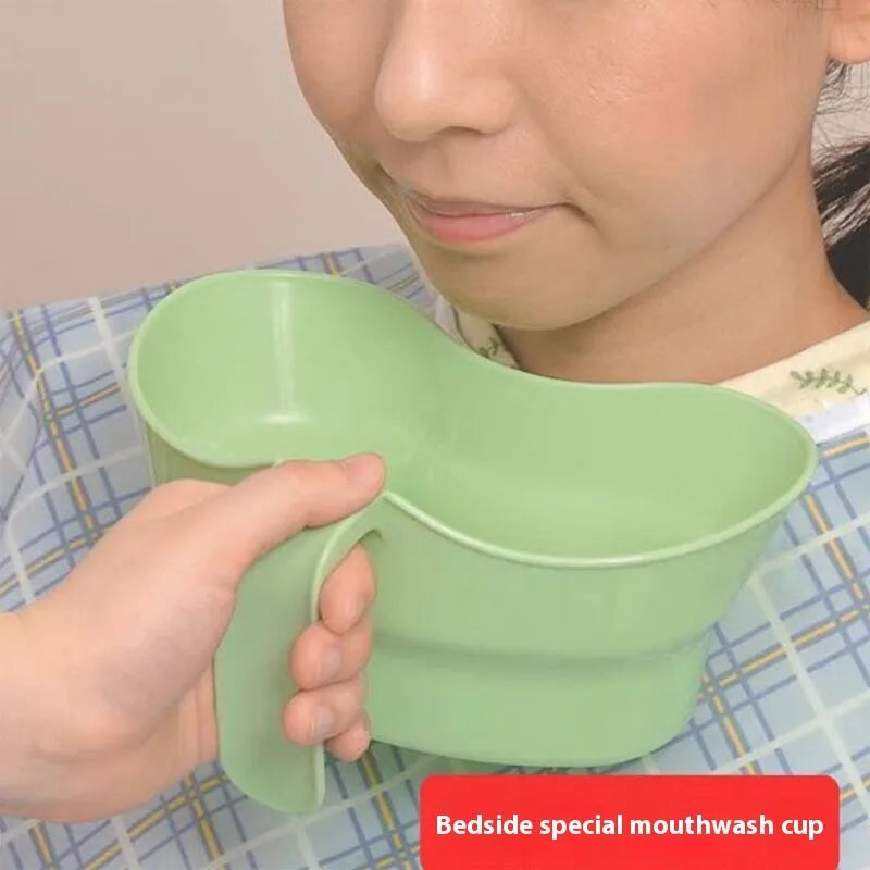 Green plastic gargle cup for bedside patient mouth care and hygiene.